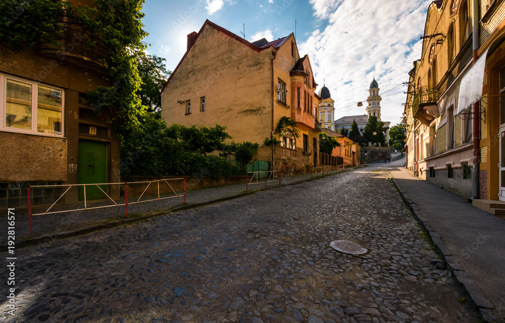 empty street of old town on summer morning. cobblestone pavement on the ground. beautiful scenery with architecture of Austria-Hungary times.