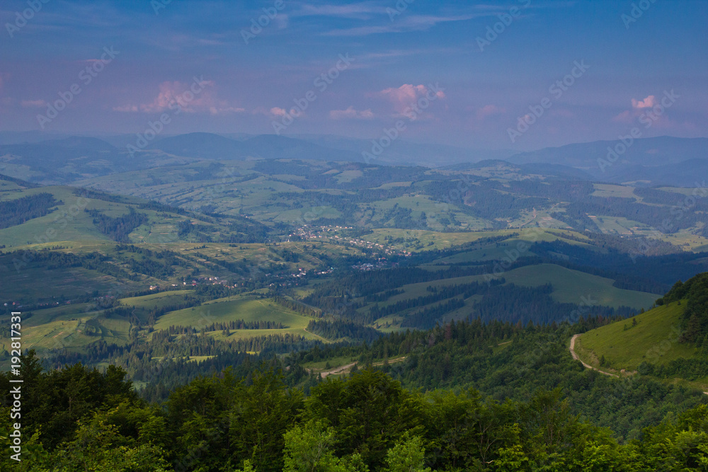 Outstanding landscape from air point of view. Green forest and the mountains are against the sky