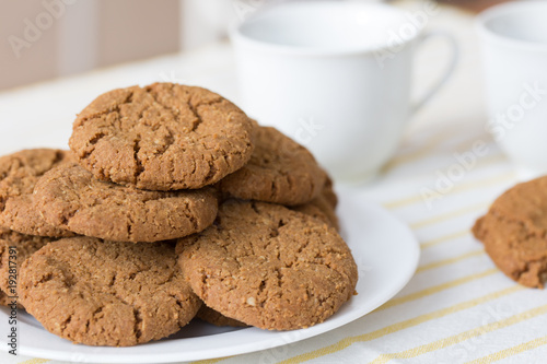 Healthy breakfast with oatmeal cookies or oatcakes and cup of tea or coffee