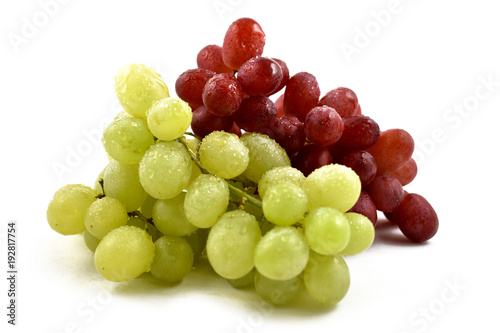 Red and white grapes stock images. Grapes on a white background. Dewy fresh grapes