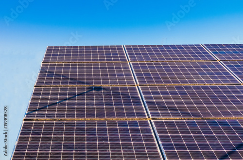 Solar power panels ,Photovoltaic modules for innovation green energy for life with blue sky background.