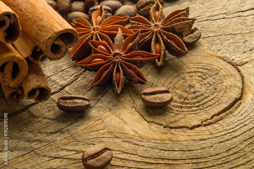Coffee beans and anise on wooden board photo