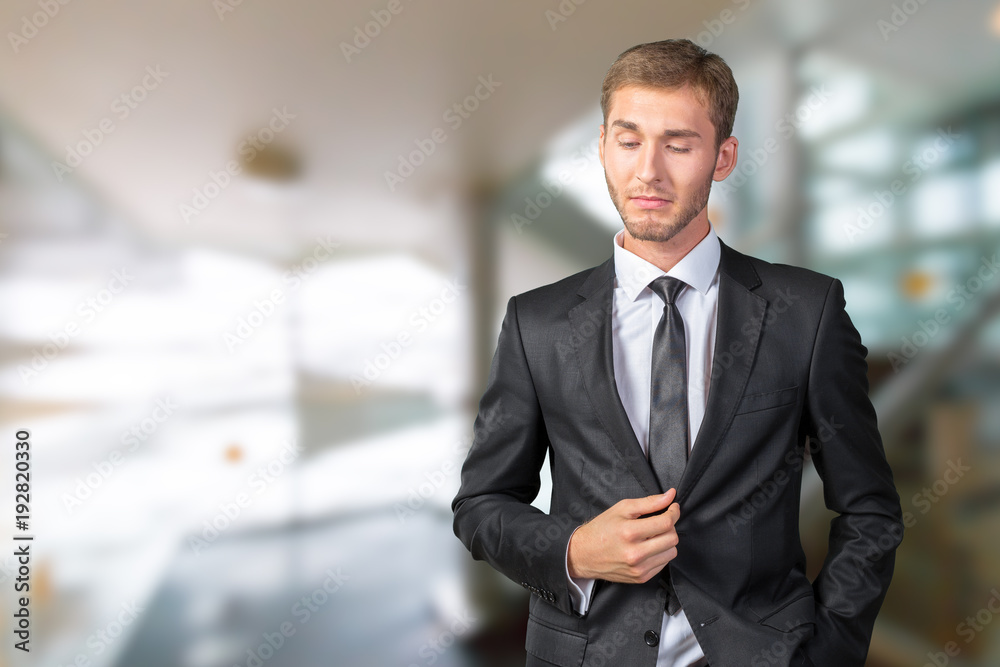 Confused young businessman thinking Confused young businessman thinking