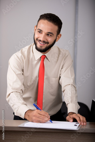 smiling while writing
