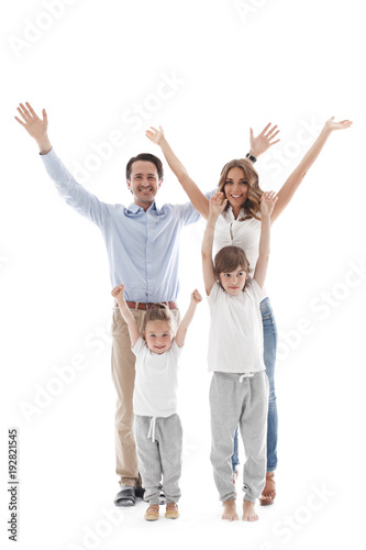 Happy family with raised hands