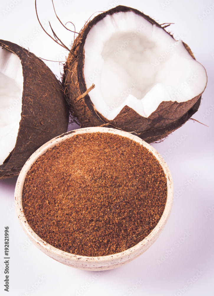 Coconut with coconut sugar isolated on white background. Coconut with coconut sugar isolated on white background.