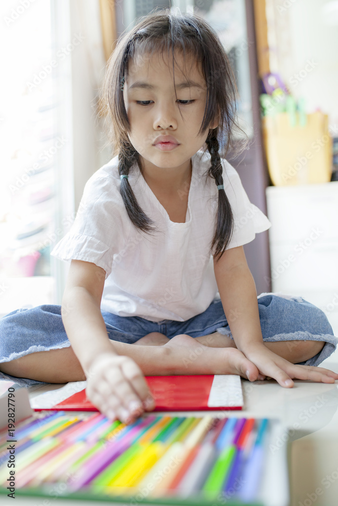 asian children playing color pencil in hoime living room asian children playing color pencil in hoime living room