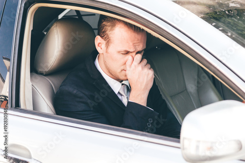 Handsome businessman in suit in a car © Art_Photo