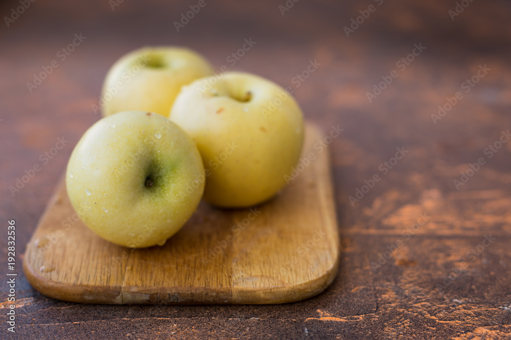 Fresh apples. Variety White pouring on a wooden cutting board Fresh apples. Variety White pouring on a wooden cutting board