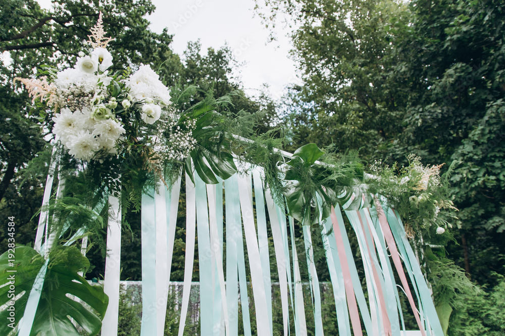 Fototapeta premium Wedding arch on a green glade.