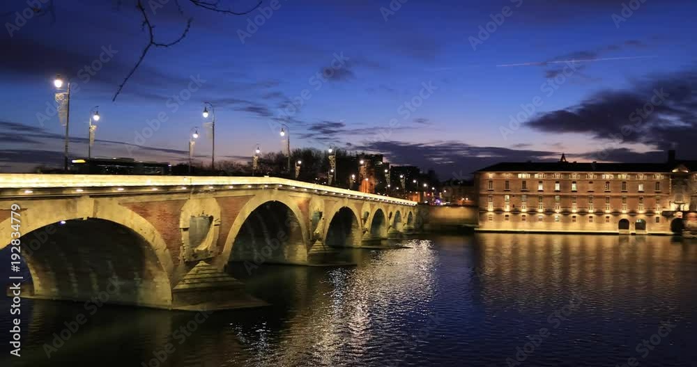 Pont Neuf (New Bridge) and renovated building of former Toulouse hospital at dusk, Toulouse, France
