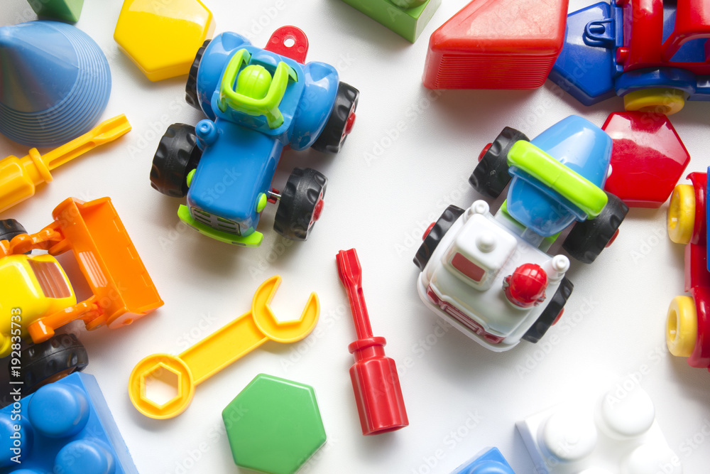 Obraz premium Kids educational developing toys frame on white background. Top view. Flat lay. Copy space for text