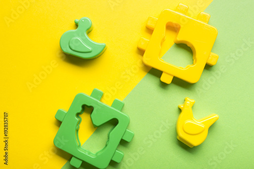 Kids educational developing toys frame on colorful background. Top view. Flat lay. Copy space for text photo