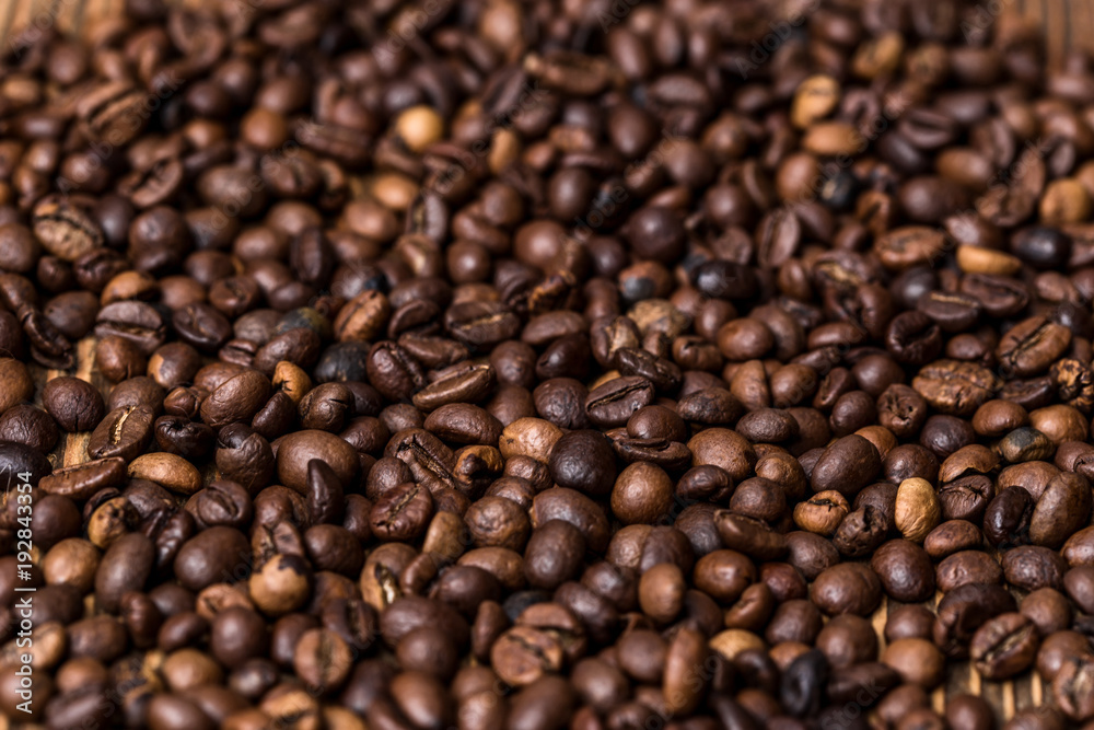 fried coffee beans. coffee beans, on a wooden background fried coffee beans. coffee beans, on a wooden background