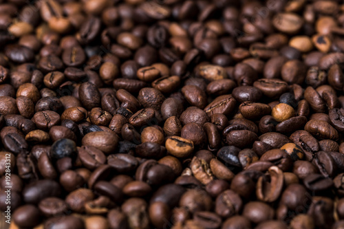 fried coffee beans. coffee beans  on a wooden background