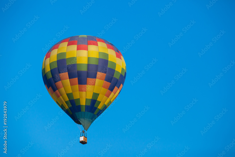 Colorful hot air balloon fly over the blue sky Colorful hot air balloon fly over the blue sky