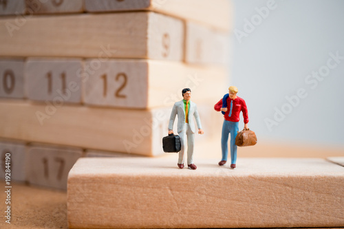 Wallpaper Mural Miniature people, couple businessmen on working site using as business and industrial concept Torontodigital.ca