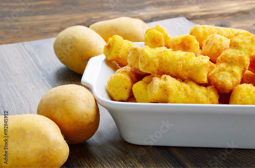 Frozen Cylindrical potato croquettes or German name is Kroketten photo