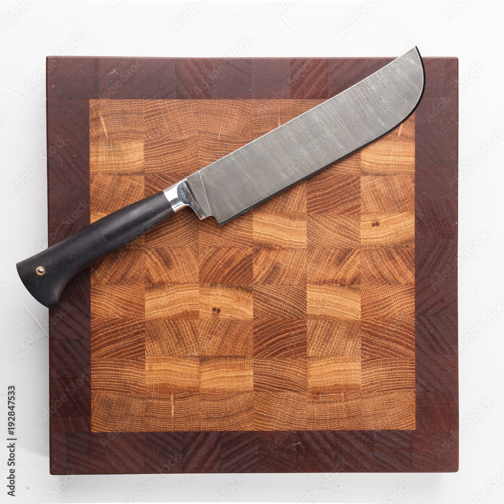 Cutting board with knife. Isolated. Top view