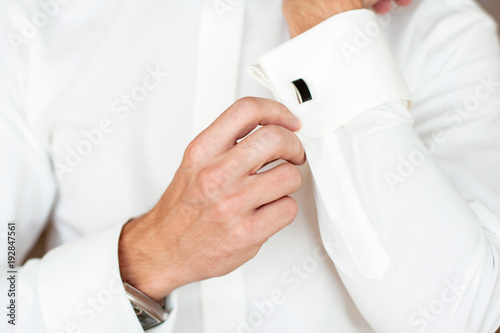 Suit up. White shirts, black cufflinks