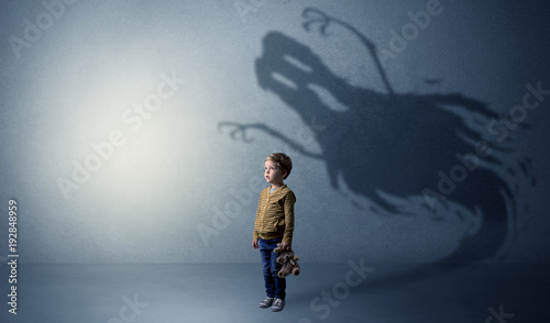 Фотография Scary ghost shadow behind kid
