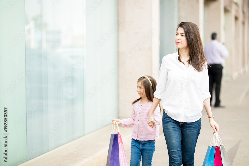 Beautiful woman shopping with her daughter Beautiful woman shopping with her daughter