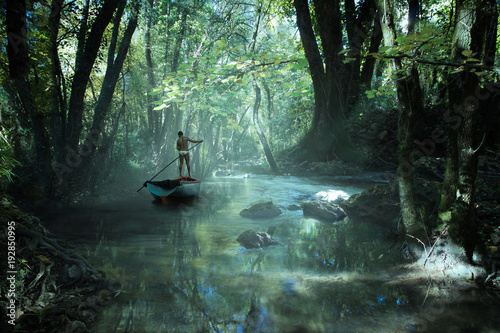 Fototapeta Naklejka Na Ścianę i Meble -  un homme navigue sur une barque dans la forêt tropicale