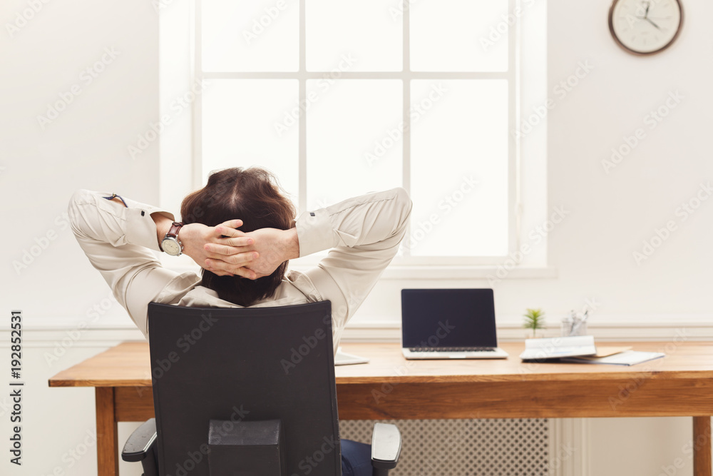Relaxed businessman in modern white office Relaxed businessman in modern white office