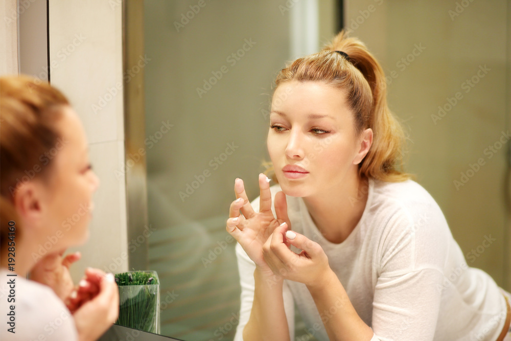 Magic anti-aging cream.Applying the cream Magic anti-aging cream.Applying the cream