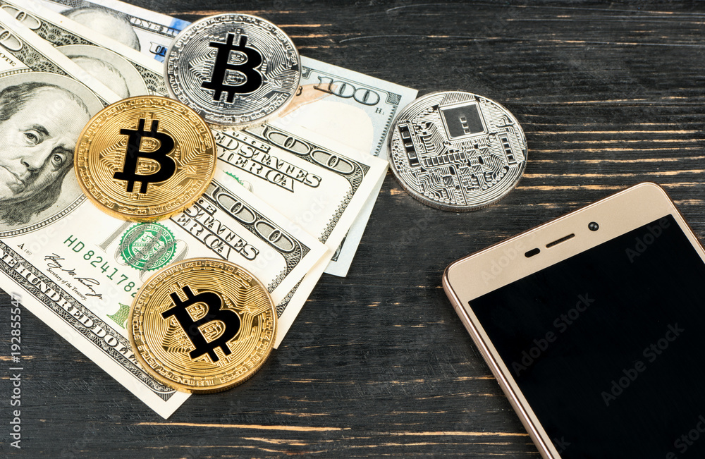 Obraz premium Bitcoin coins with dollars