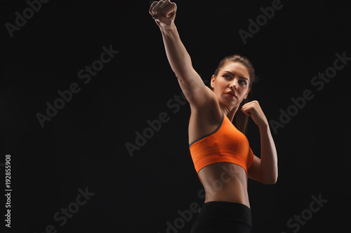 Athletic woman preparing for fight