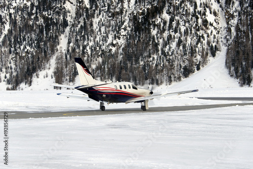 A private jet is ready to take off in the airport of St Moritz Switzerland in winter