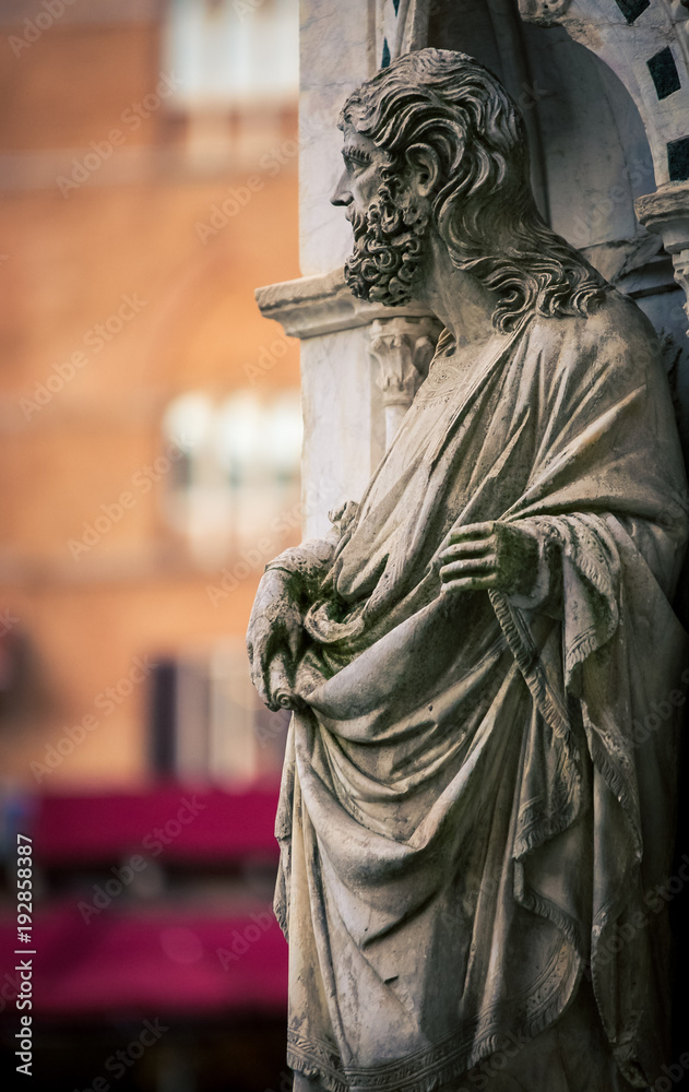 religious statue with robe and beard
