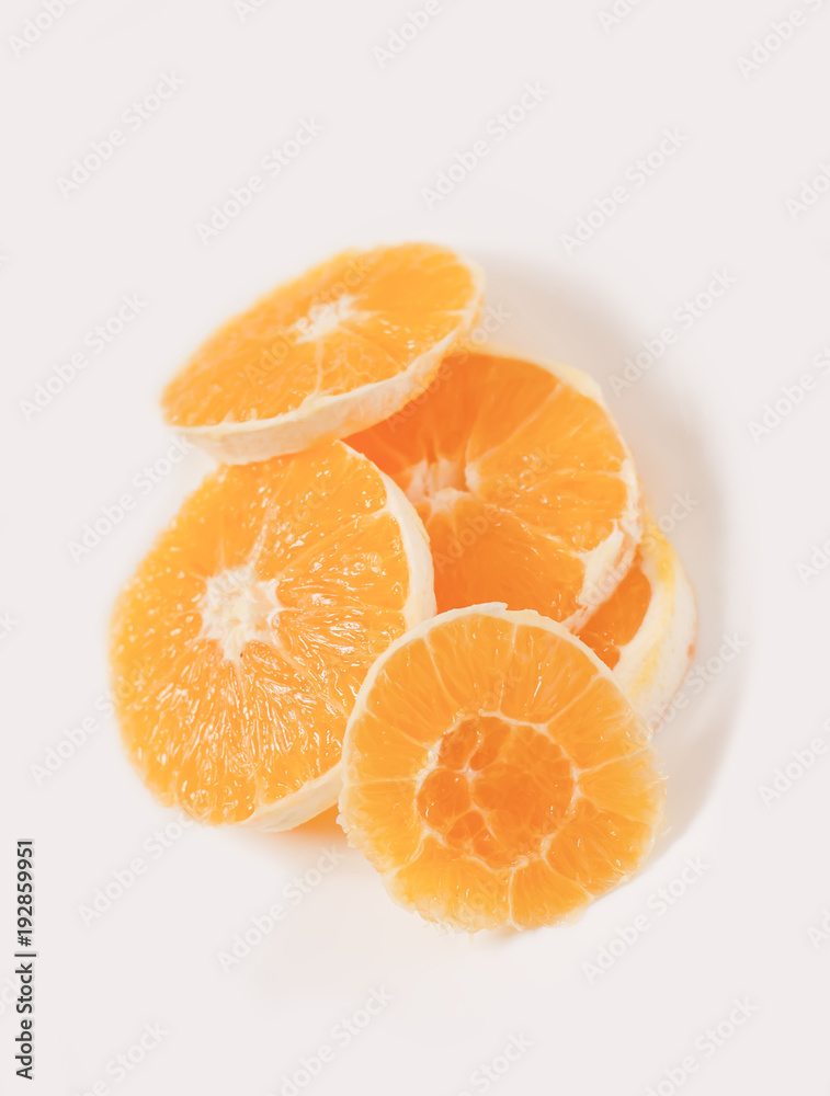 Sliced orange on a whiite plate Sliced orange on a whiite plate