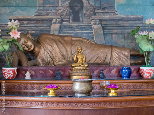 Statue of the Buddha god in the Buddhist temple Brahma Vihara Arama with statues of the gods on Bali island, Indonesia. Bali Architecture, Ancient design. Travel concept. photo