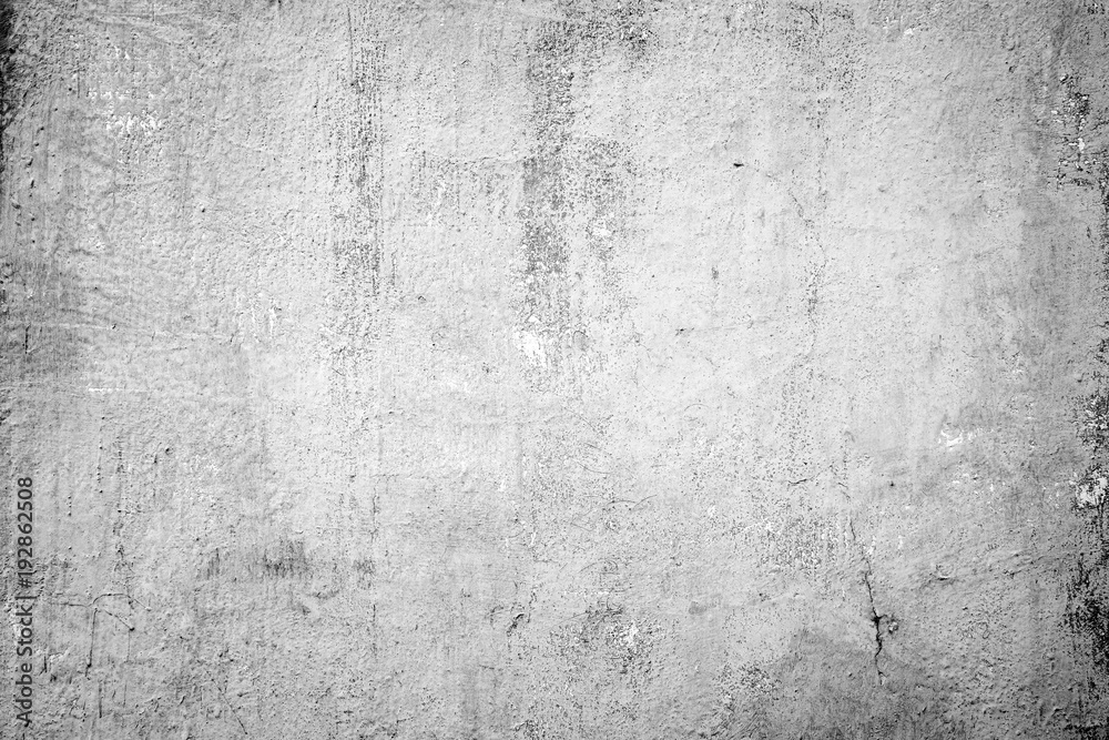 Weathered and dirty concrete wall texture background in black and white with vignetting