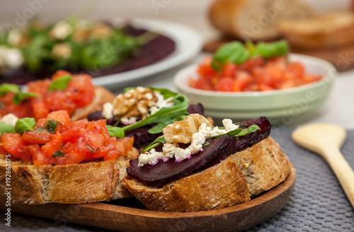 Bruschetta and sandwich with beetroot, beet carpaccio on the background - healthy food