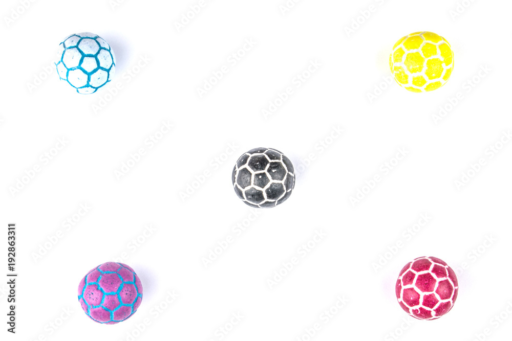 Multicolored candy in the shape of soccer balls on a white background. Isolated. Multicolored candy in the shape of soccer balls on a white background. Isolated.