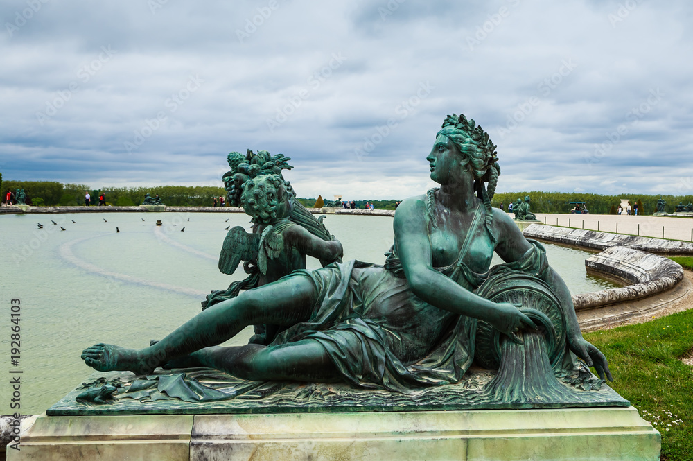 Ponds (Water Parterres) and statues in front of the main building of the Palace of Versailles