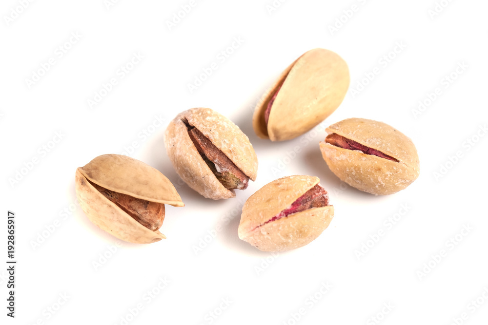 Heap of salted pistachio nuts isolated on a white background Heap of salted pistachio nuts isolated on a white background