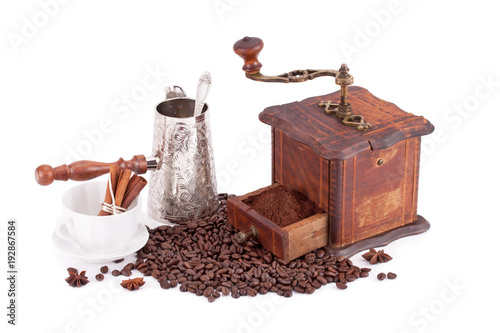 Old coffee grinder maker and coffee beans .