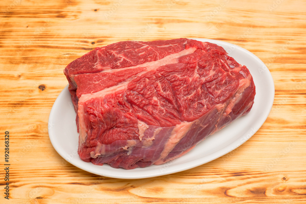 steak fat beef with white plate and old wooden board steak fat beef with white plate and old wooden board
