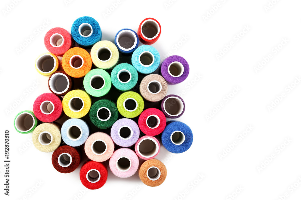 Colourful thread spools isolated on a white Colourful thread spools isolated on a white