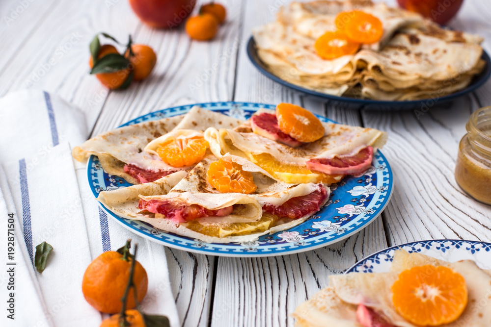 Maslenitsa. Crepe Suzet. Thin pancakes with honey and citrus Maslenitsa. Crepe Suzet. Thin pancakes with honey and citrus