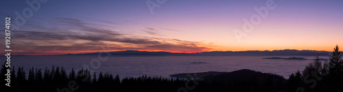 View from mountain Schoeckl over low stratus to beautiful sunset