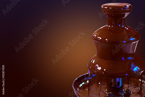 Chocolate fountain fondue. Sweets and making desserts. Chocolate fountain on a dark gradient background