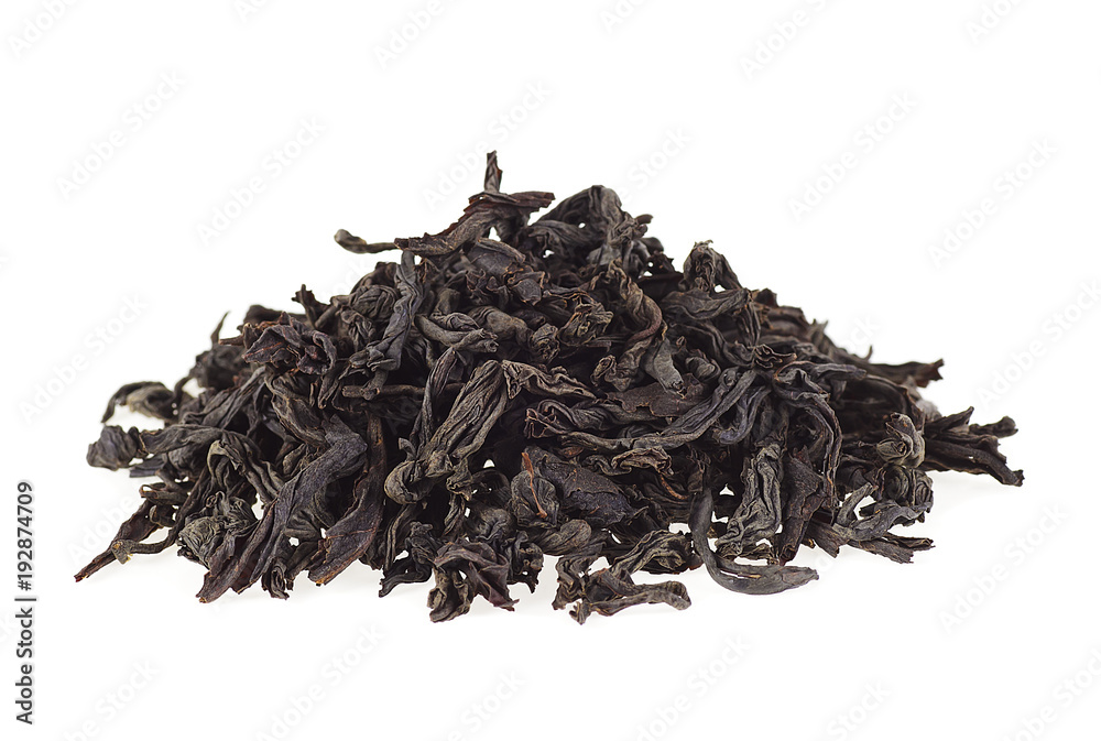 Dry black tea leaves on a white background Dry black tea leaves on a white background