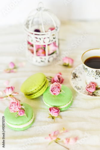 Dessert With Coffee: A Delicate Fresh French Macaroons In Pastel Colors Gift Box Flowers Roses On Light Blue Wooden Background