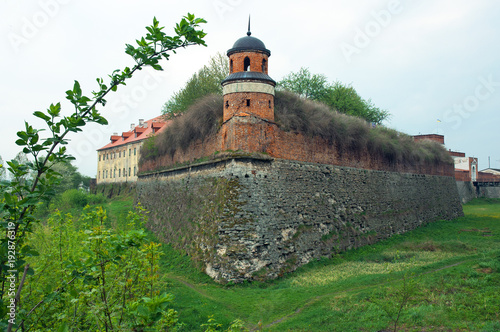 Piece of old castle on cloudy day photo