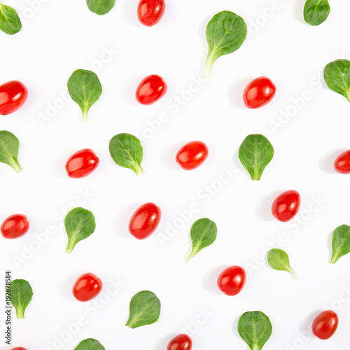 Pattern of basil leaves and tomatoes